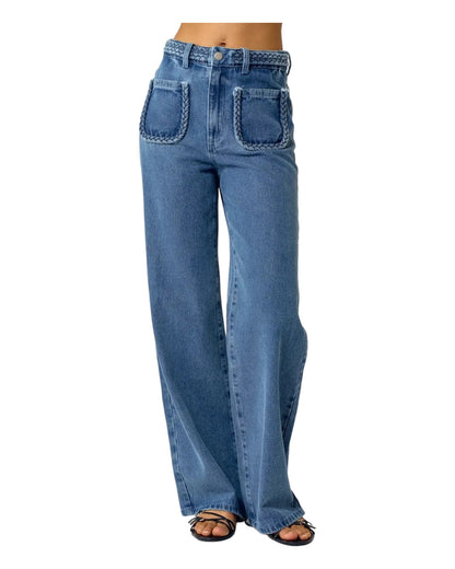 High waist blue denim jeans with braided waistband detail, straight wide-leg fit, and extra-high waist. Made from no-stretch fabric with front pockets and a longer inseam, ideal for a slender silhouette. Medium blue washed denim.