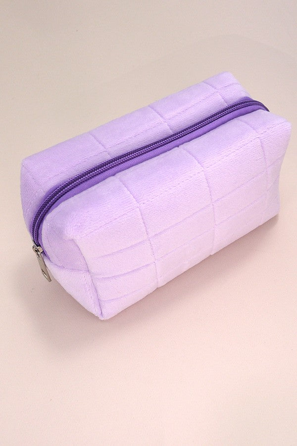 Luxurious velvet travel cosmetic makeup pouch with a zip closure, perfect for storing beauty essentials.