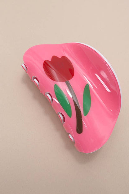 Whimsical Round hair claw clip featuring a flower design and available in five colors. Designed for effortless styling and a secure, comfortable hold.