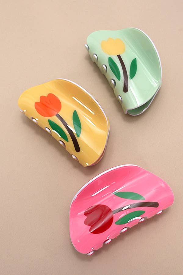 Whimsical Round hair claw clip featuring a flower design and available in five colors. Designed for effortless styling and a secure, comfortable hold.