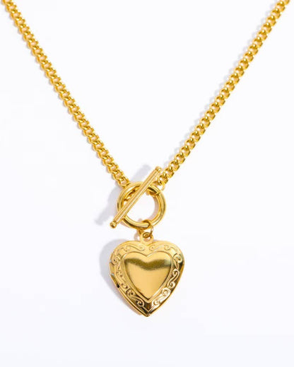 Gold locket necklace with a toggle closure, crafted from 18K gold-dipped stainless steel, tarnish-free and hypoallergenic.