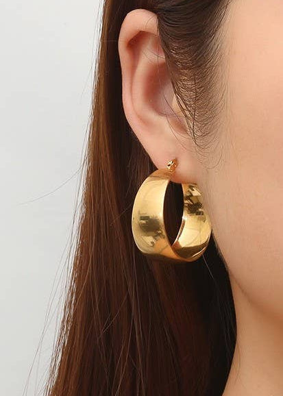 Tarnish-Free Chunky 18K Stainless Gold Hoops with a bold design, crafted from waterproof and hypoallergenic stainless steel.