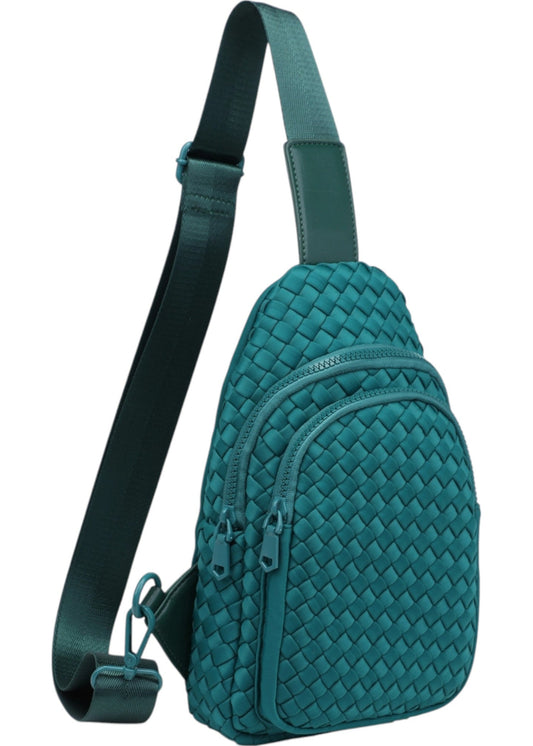 Woven neoprene women's sling backpack in Forest Green with adjustable strap and zippered compartments.