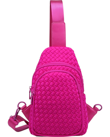 Woven neoprene women's sling backpack in Fuchsia with adjustable strap and zippered compartments.