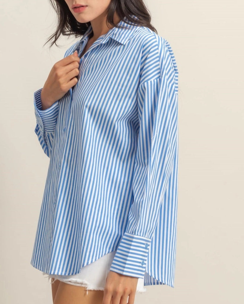 Blue and white striped 100% cotton button-up shirt with a collar and long sleeves.