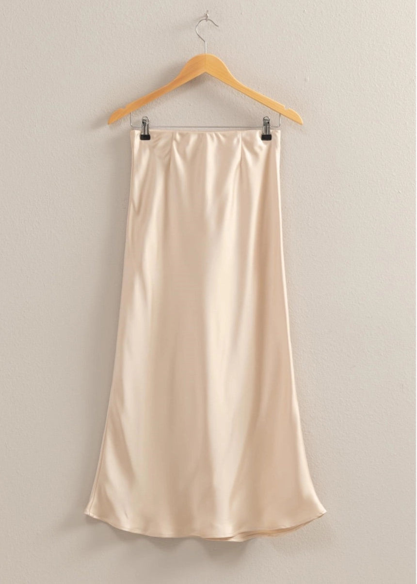 Cream Satin midi skirt with a mid-rise silhouette, pull-on elastic waist, and breezy hem.