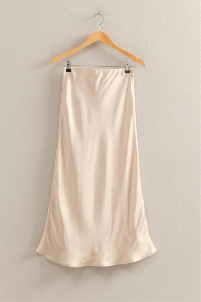 Cream Satin midi skirt with a mid-rise silhouette, pull-on elastic waist, and breezy hem.