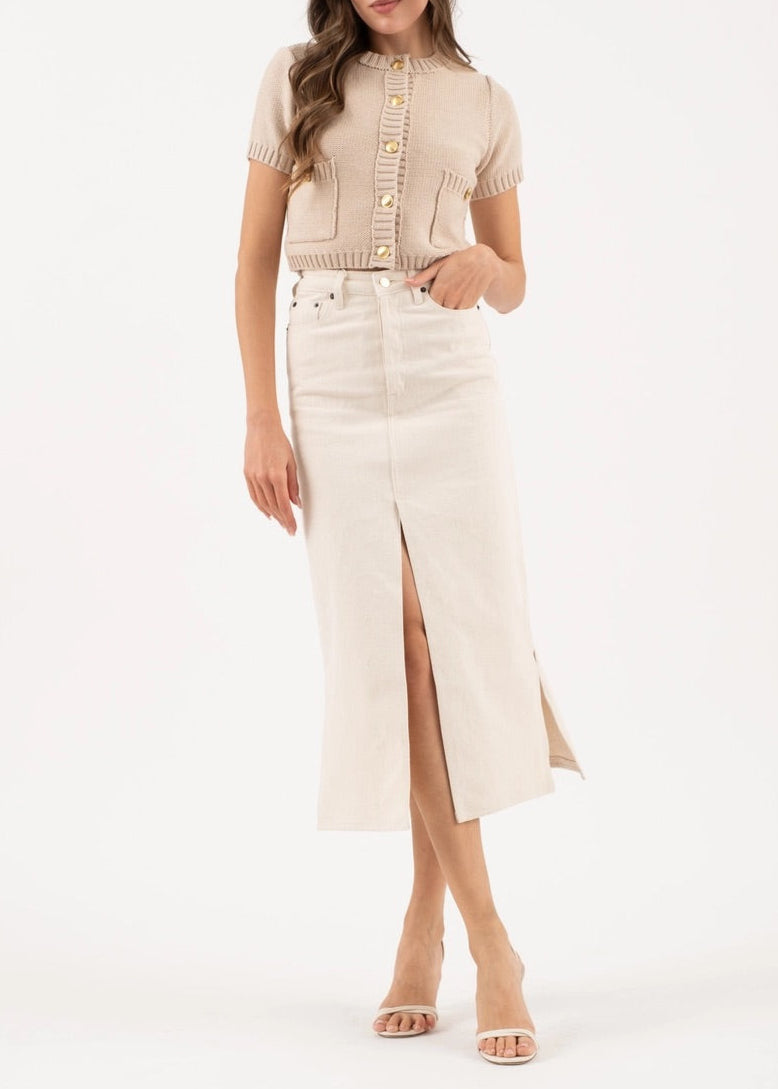 Taupe cropped knit cardigan with gold button hardware, short sleeves, and ribbed trim details.