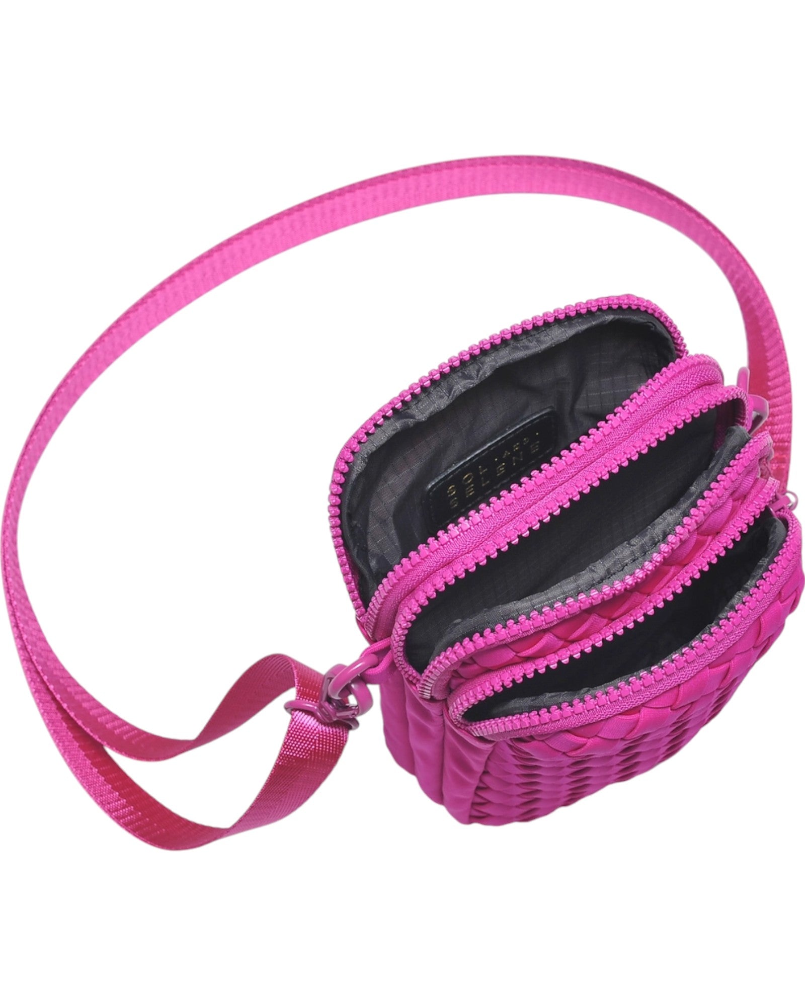 Compact neoprene cell phone crossbody bag with three zippered compartments and adjustable strap in Fuchsia.