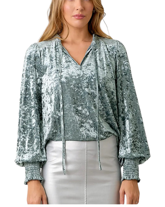 Woman wearing a Ice Blue Crushed Velvet Long Sleeve Top.