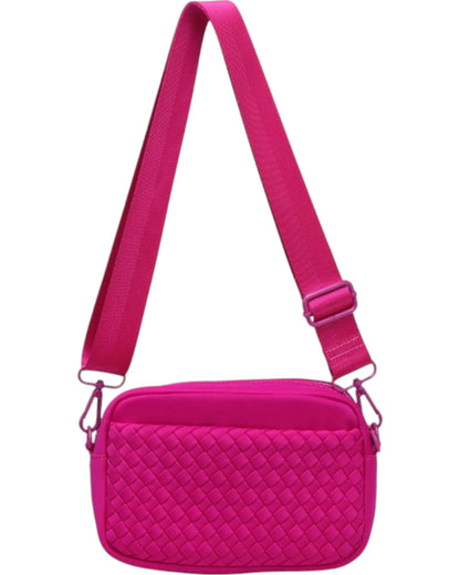 Woven neoprene crossbody bag with adjustable strap, top zip closure, and convenient side pockets.