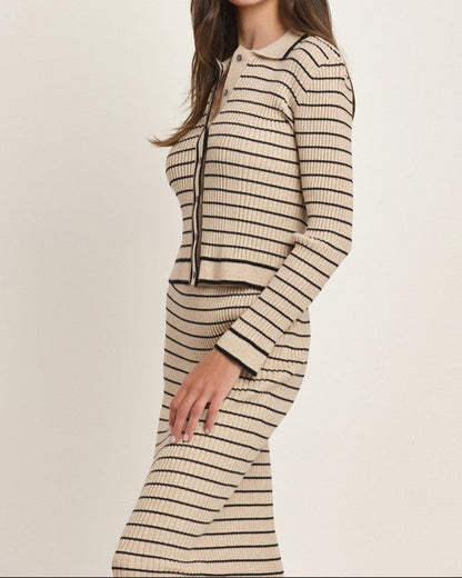 Tan and black striped knit two-piece set with a button-up cardigan top and midi skirt.