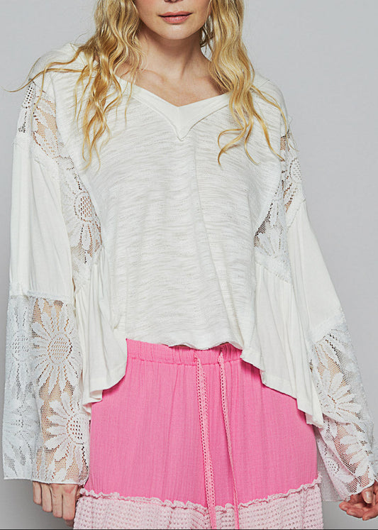 White V-neck relaxed-fit boho top with flare sleeves and floral lace detailing.