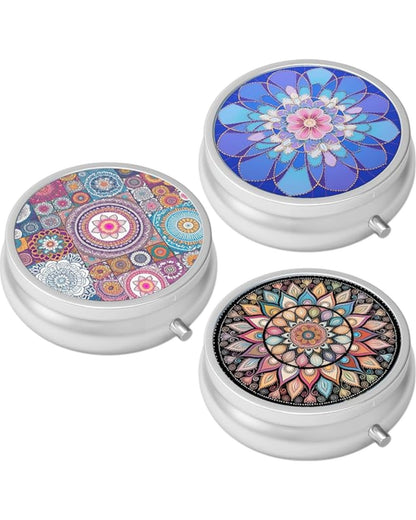 Small circular portable pill case with metal exterior, beautiful design, and secure clasp.