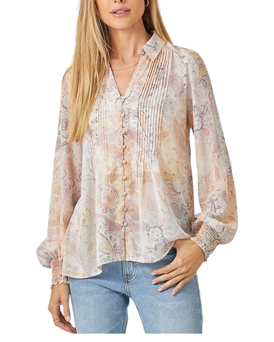 Woman wearing a pastel semi-sheer floral paisley button up long sleeve blouse.