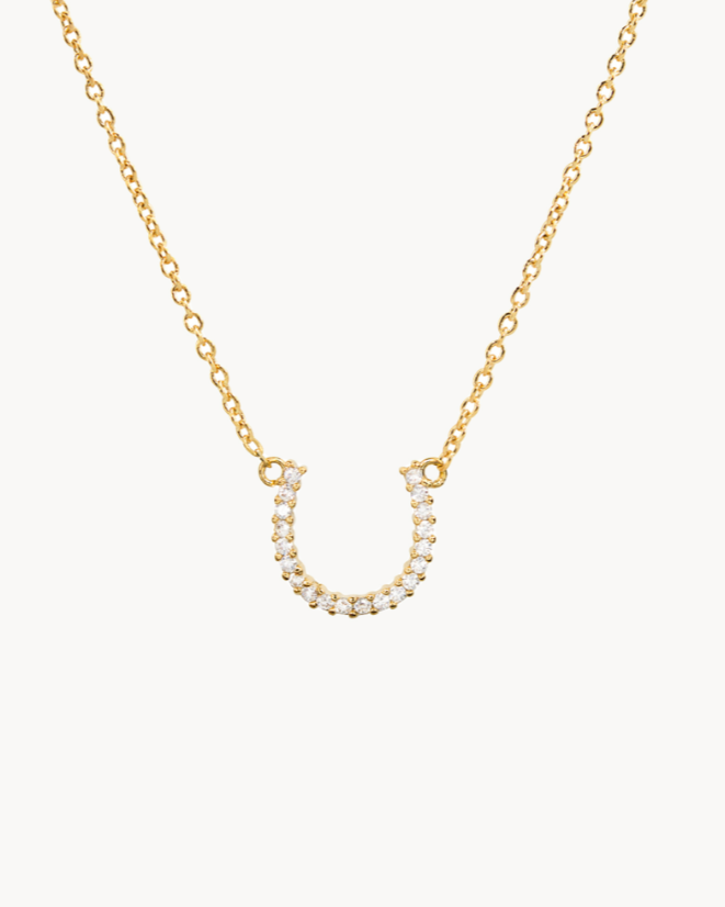 14K gold-dipped, sparkling lucky horseshoe CZ necklace with an adjustable chain.