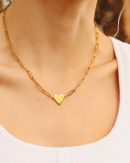 Gold waterproof paperclip chain necklace with a heart pendant. 