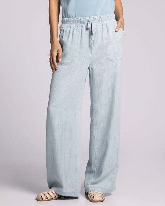 Light blue herringbone 100% Tencel™ Lyocell relaxed pants with an elastic waistband and drawstring.