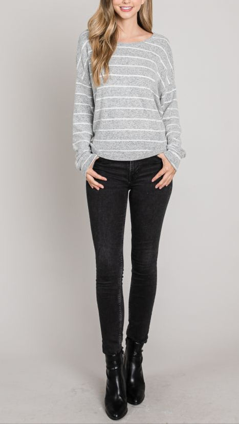 A heather grey sweater with white stripes featuring a twist-back open design and long sleeves.