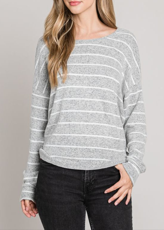 A heather grey sweater with white stripes featuring a twist-back open design and long sleeves.