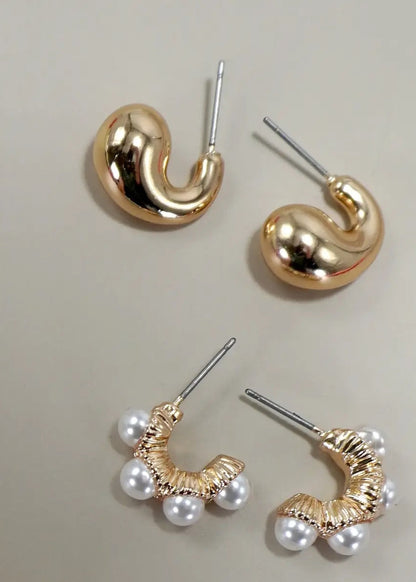 Set of 3 gold-plated huggie hoop earrings, including one pair with pearl accents and hypoallergenic titanium posts.